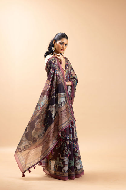 Woman wearing a long, patterned dress against a beige background Gajleela Chanderi Saree |   Yuvani Vesture
