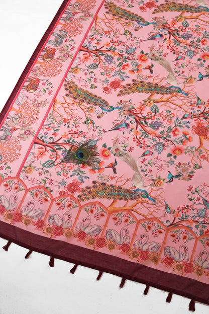 Decorative pink fabric with intricate patterns of birds, flowers, and animals on a white background. Madhuri Van Chanderi Cotton Saree | Yuvani Vesture