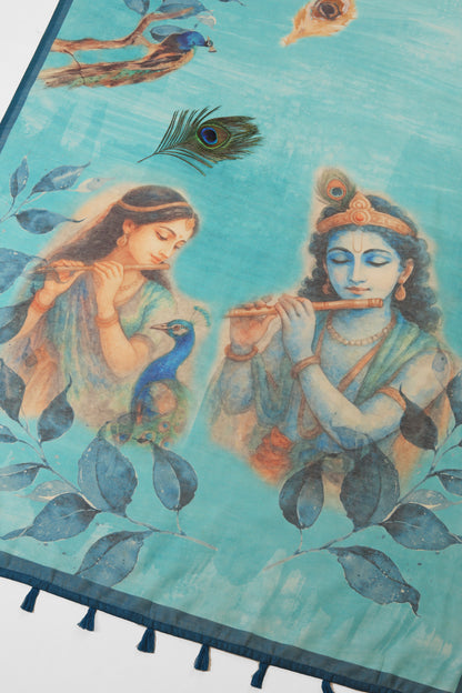 Decorative mat with artistic depiction of two figures playing flutes, surrounded by peacocks and leaves on a blue background. Mor Bansi Blue Chanderi Saree | Yuvani Vesture