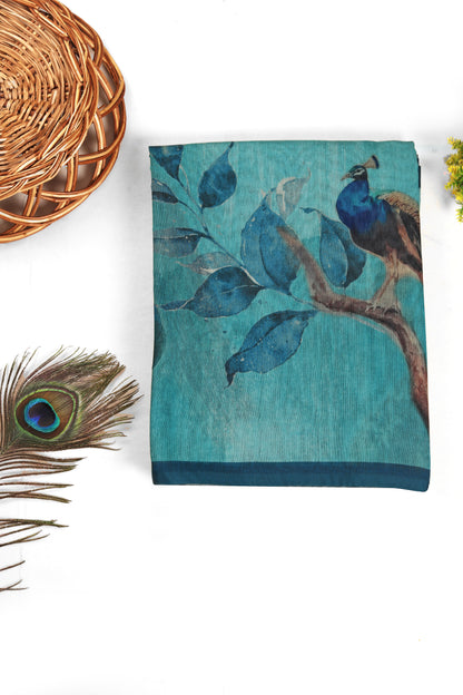 Teal towel with peacock design on a white background Mor Bansi Blue Chanderi Saree | Yuvani Vesture
