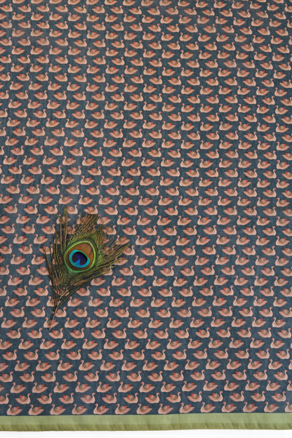 Peacock feather on a fabric with a pattern of small birds. Padma Vilas Chanderi Cotton Saree | Yuvani Vesture