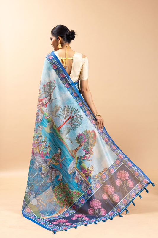 Woman wearing a colorful saree with a nature-themed design on a beige background Tarangini Chanderi Saree | Yuvani Vesture