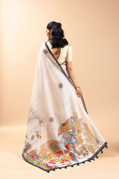 Woman wearing a saree with intricate designs on a beige background Vrindavan Vaas Chanderi Saree | Yuvani Vesture